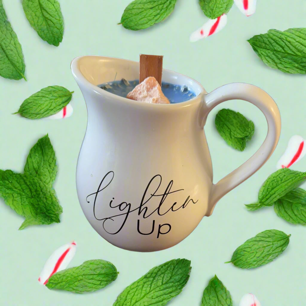 Candle in a cream pitcher with wood wick