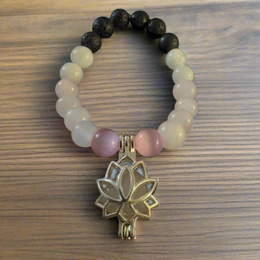 bracelet with lava stones, lotus charm and rose quartz