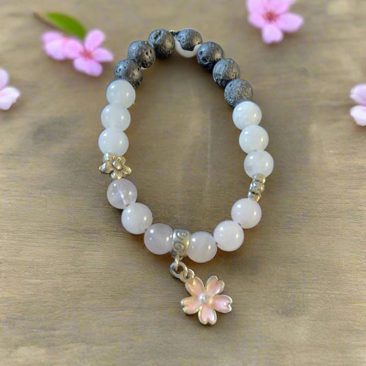 lava stones, rose quartz, white jade, and a pink cherry blossom center dangle charm